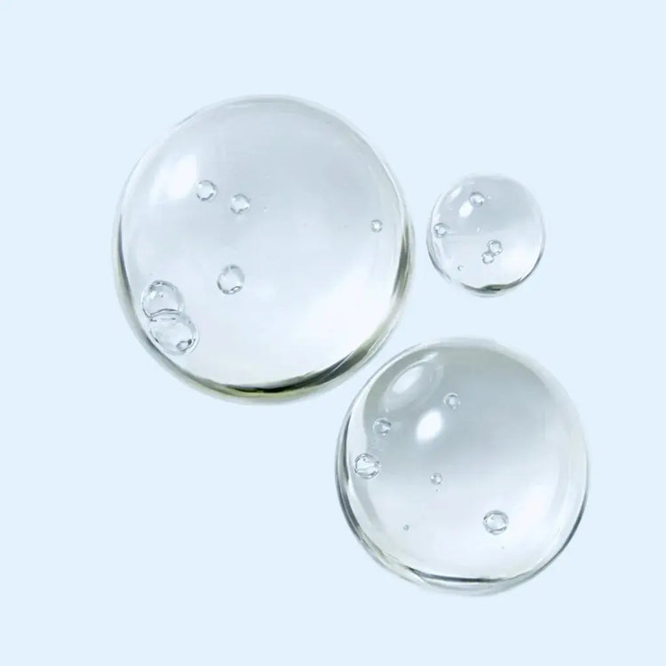 Three clear glass bowls of different sizes on a light gray background